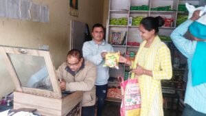 Beneficiary Smt. Radharani purchasing Him Bhog Makki Atta at the Civil Supplies Depot in Kitla Kalan